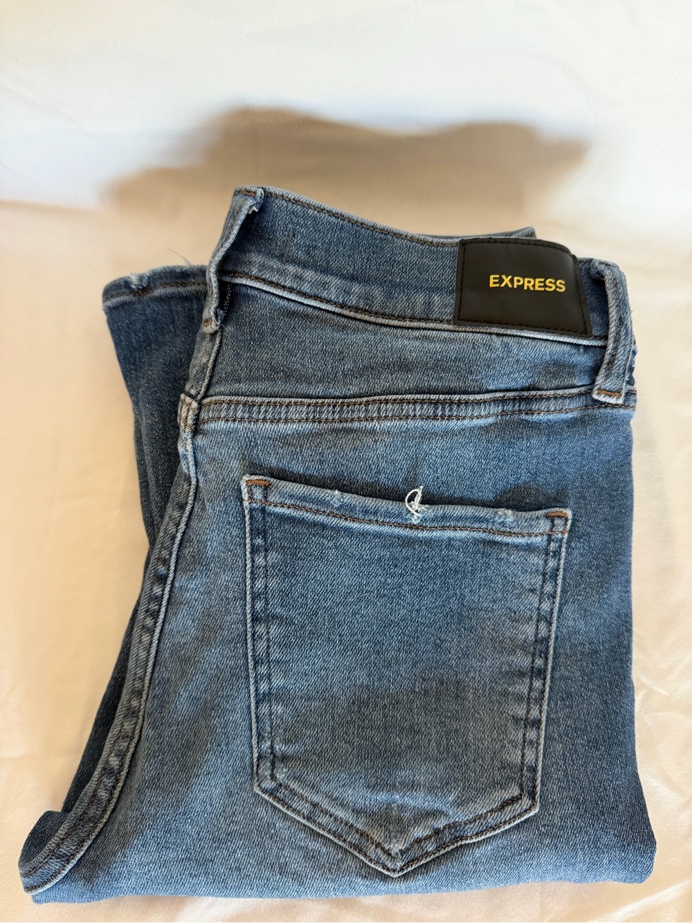Express Women's Skyscraper Mid Rise Skinny Flare Jeans in Mid Blue Wash